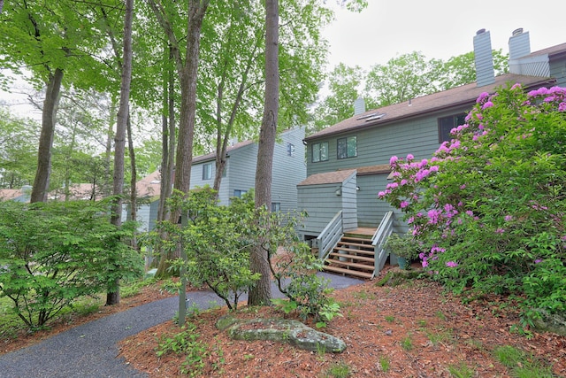 26 Evergreen Rd Unit 26, Torrington, CT 06790 - rear view of property featuring a chimney and a deck