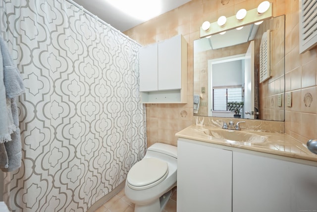 26 Evergreen Rd Unit 26, Torrington, CT 06790 - bathroom with tile walls, vanity, toilet, and tile patterned flooring