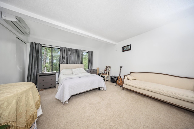 26 Evergreen Rd Unit 26, Torrington, CT 06790 - bedroom featuring an AC wall unit, light carpet, a closet, and beam ceiling