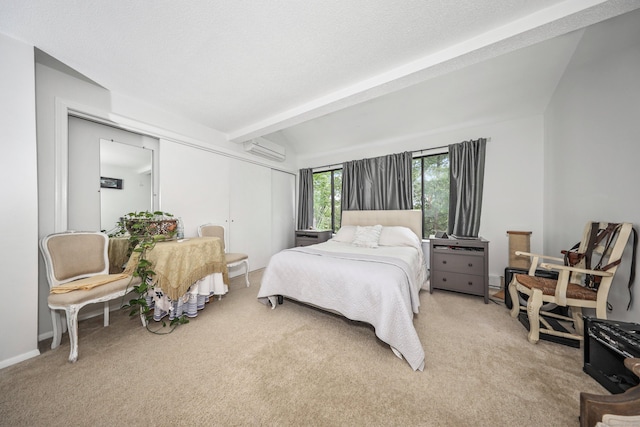 26 Evergreen Rd Unit 26, Torrington, CT 06790 - bedroom featuring an AC wall unit, light colored carpet, beamed ceiling, and a closet