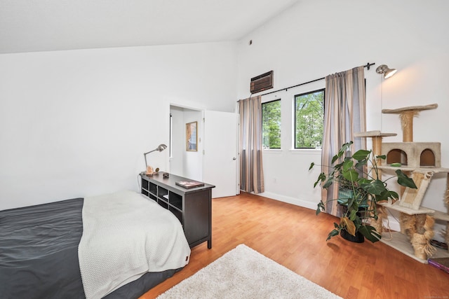 26 Evergreen Rd Unit 26, Torrington, CT 06790 - bedroom featuring light wood-style floors, baseboards, and high vaulted ceiling