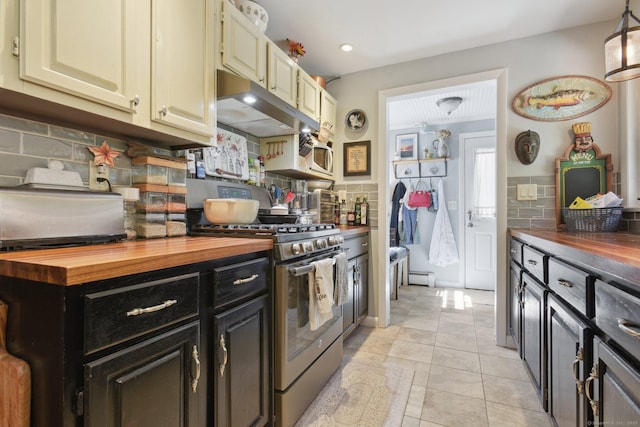 56 Giants Neck Rd, East Lyme, CT 06357 - kitchen with butcher block countertops, stainless steel range with gas cooktop, backsplash, dark cabinetry, and recessed lighting