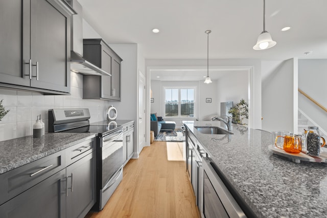 129 Shea Cir Unit 129, Cheshire, CT 06410 - kitchen with stainless steel range with electric stovetop, a sink, light wood-type flooring, dark stone counters, and gray cabinets