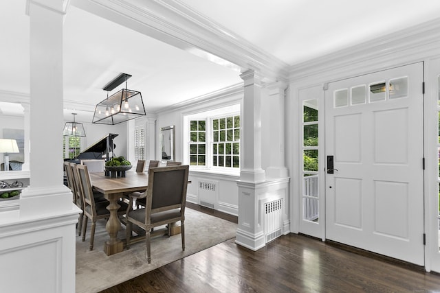 7 Over Rock Ln, Westport, CT 06880 - dining area featuring decorative columns, a decorative wall, dark wood finished floors, crown molding, and radiator heating unit