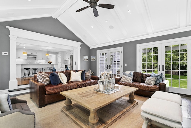 7 Over Rock Ln, Westport, CT 06880 - living room with french doors, ceiling fan, beam ceiling, decorative columns, and high vaulted ceiling