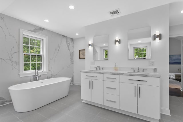 7 Over Rock Ln, Westport, CT 06880 - bathroom with double vanity, recessed lighting, a soaking tub, and ensuite bath