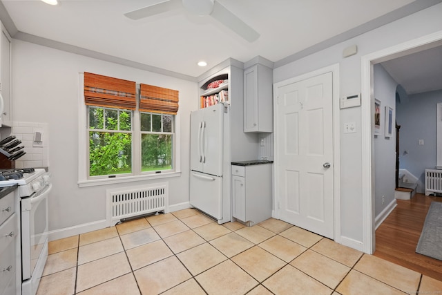 161 Crestwood Rd, Fairfield, CT 06824 - kitchen featuring radiator heating unit, white appliances, dark countertops, a ceiling fan, and recessed lighting