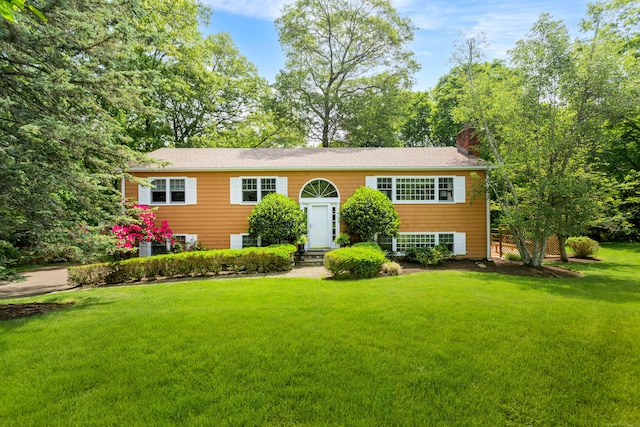 21 Forest Rd, Weston, CT 06883 - raised ranch with a chimney and a front lawn