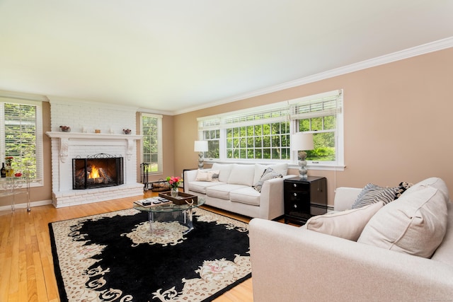 21 Forest Rd, Weston, CT 06883 - living area with crown molding, wood finished floors, a brick fireplace, baseboards, and a baseboard radiator