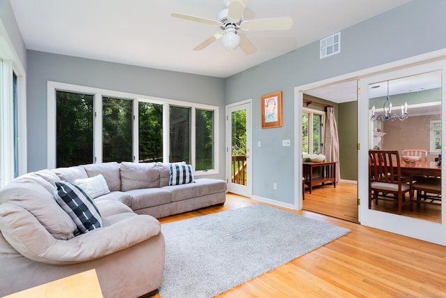 21 Forest Rd, Weston, CT 06883 - living area with a chandelier, light wood-type flooring, healthy amount of natural light, and a ceiling fan