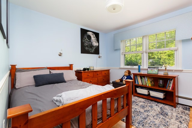 21 Forest Rd, Weston, CT 06883 - bedroom with wood finished floors and a baseboard radiator