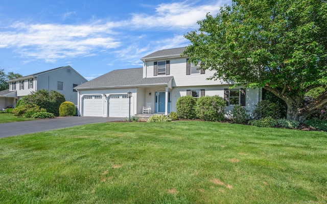 31 S Meadow Ln, Enfield, CT 06082 - view of front of home with asphalt driveway, a garage, and a front yard