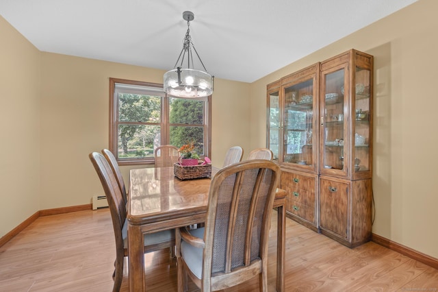 31 S Meadow Ln, Enfield, CT 06082 - dining area featuring light wood-type flooring, a baseboard heating unit, baseboards, and a chandelier