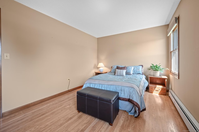 31 S Meadow Ln, Enfield, CT 06082 - bedroom featuring a baseboard heating unit, wood finished floors, and baseboards