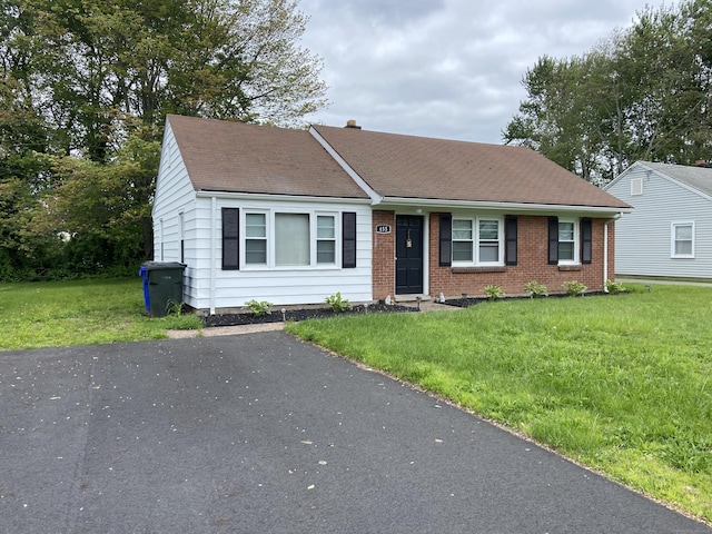 455 Middletown Ave, Wethersfield, CT 06109 - view of front of property featuring a front yard, a shingled roof, and brick siding