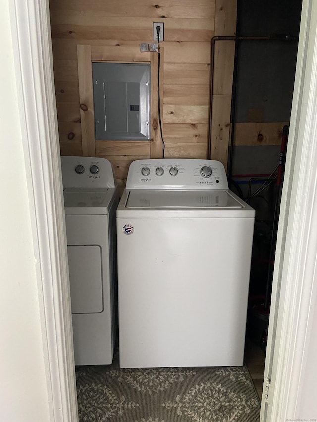 455 Middletown Ave, Wethersfield, CT 06109 - washroom featuring electric panel, washing machine and clothes dryer, and wooden walls