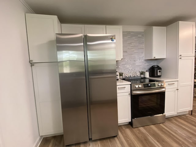 455 Middletown Ave, Wethersfield, CT 06109 - kitchen with stainless steel appliances, light wood-style flooring, and white cabinetry