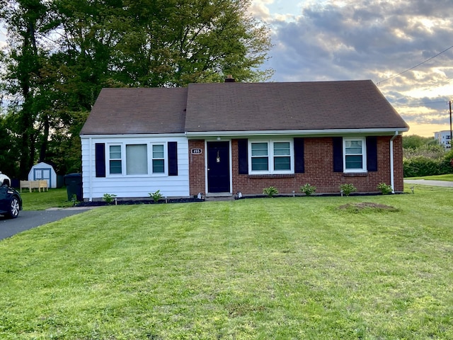455 Middletown Ave, Wethersfield, CT 06109 - view of front facade featuring a lawn, brick siding, and a storage shed