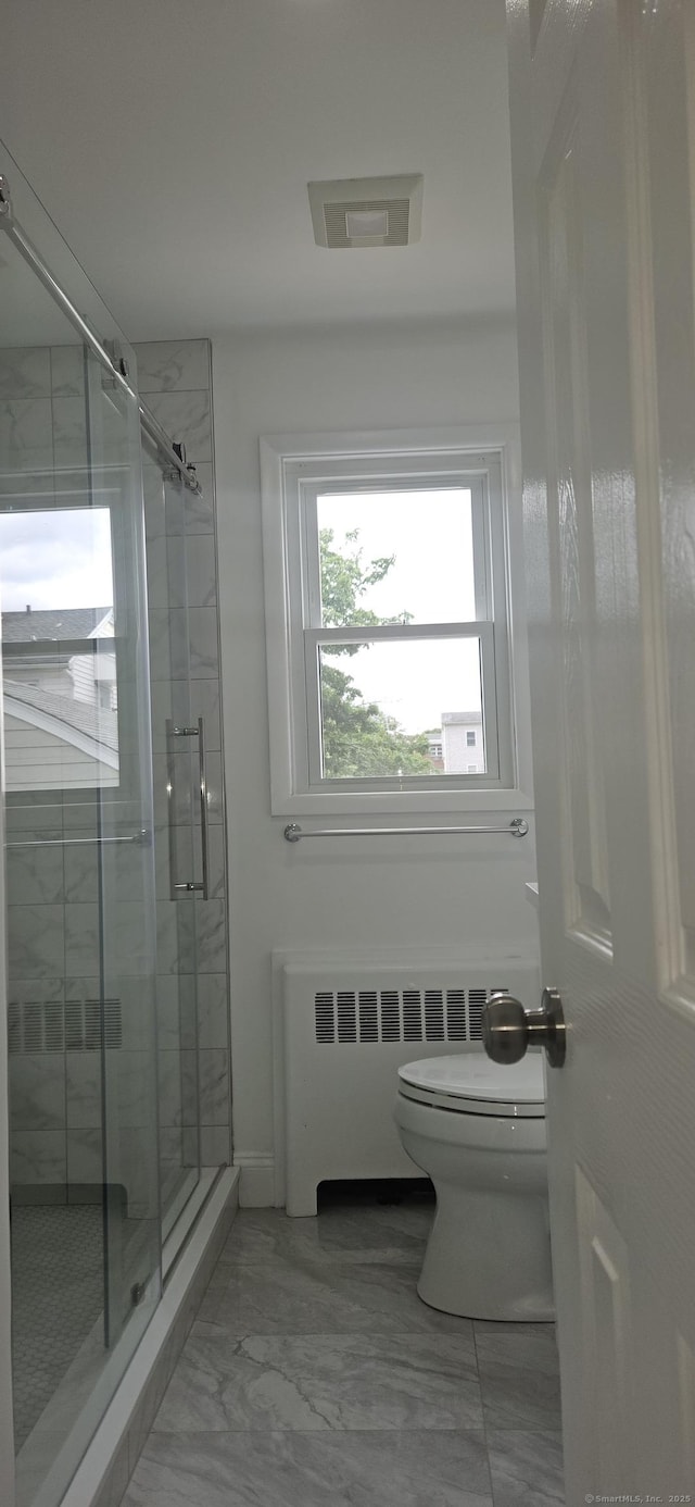 265 Harlem Ave, Bridgeport, CT 06606 - full bathroom featuring radiator, toilet, marble finish floors, and a stall shower