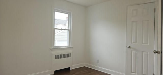 265 Harlem Ave, Bridgeport, CT 06606 - spare room with radiator, plenty of natural light, baseboards, and dark wood-style flooring