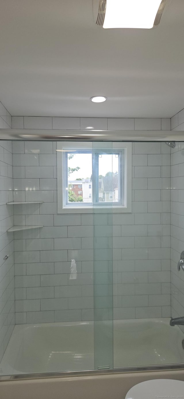 265 Harlem Ave, Bridgeport, CT 06606 - bathroom featuring enclosed tub / shower combo and toilet