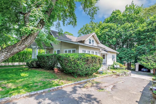 15 Dartley St, Stamford, CT 06905 - view of front of property featuring an outbuilding and a front lawn