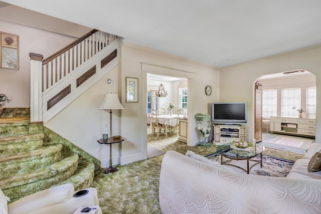 15 Dartley St, Stamford, CT 06905 - carpeted living room featuring stairs, arched walkways, crown molding, and a chandelier