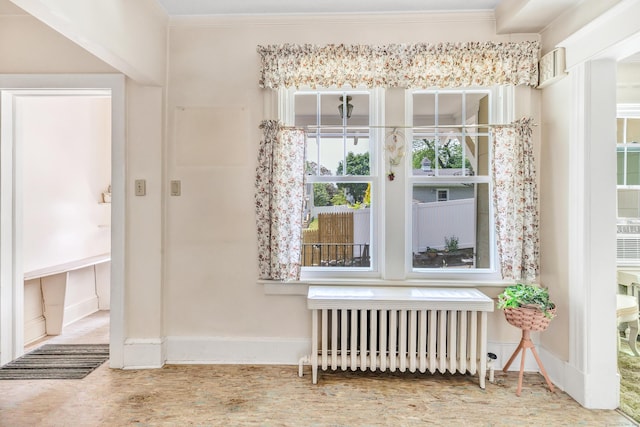 15 Dartley St, Stamford, CT 06905 - entrance foyer with radiator, ornamental molding, wood finished floors, and baseboards