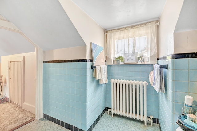 15 Dartley St, Stamford, CT 06905 - bathroom with radiator heating unit, tile walls, and wainscoting