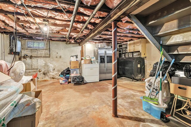 15 Dartley St, Stamford, CT 06905 - below grade area featuring heating fuel, stainless steel refrigerator with ice dispenser, and washer and clothes dryer