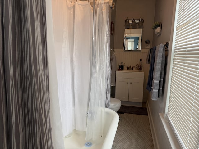 39 Swain Ave, Meriden, CT 06450 - full bath with vanity, toilet, wainscoting, a shower with curtain, and a bathtub