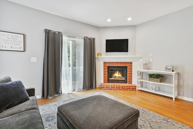 2 Turtle Spring Ln Unit 2, Newtown, CT 06470 - living area with wood finished floors, a brick fireplace, recessed lighting, and baseboards