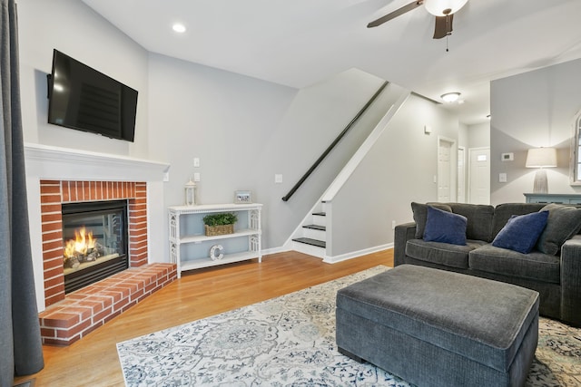 2 Turtle Spring Ln Unit 2, Newtown, CT 06470 - living room with wood finished floors, a ceiling fan, stairway, a brick fireplace, and recessed lighting