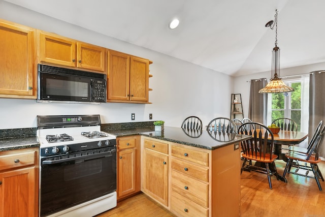 2 Turtle Spring Ln Unit 2, Newtown, CT 06470 - kitchen with black microwave, gas range, a peninsula, lofted ceiling, and light wood-style flooring