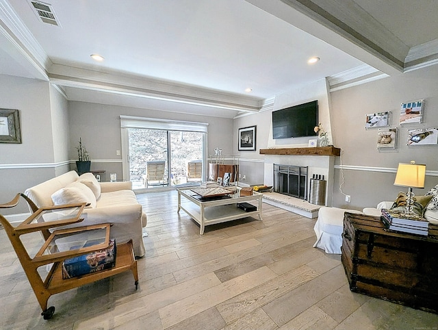 1036 Heritage Vlg Unit A, Southbury, CT 06488 - living area with crown molding, beam ceiling, a fireplace with raised hearth, light wood-style flooring, and recessed lighting