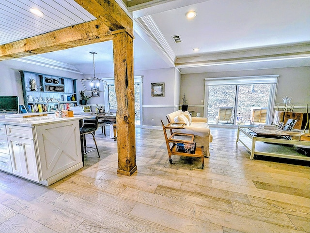 1036 Heritage Vlg Unit A, Southbury, CT 06488 - living area featuring light wood-style flooring, crown molding, recessed lighting, beamed ceiling, and a chandelier