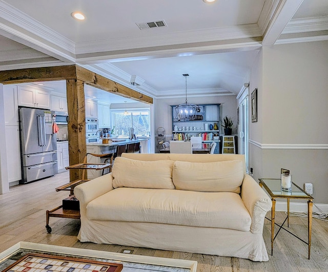 1036 Heritage Vlg Unit A, Southbury, CT 06488 - living room featuring light wood-type flooring, a chandelier, crown molding, recessed lighting, and baseboards