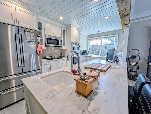 1036 Heritage Vlg Unit A, Southbury, CT 06488 - kitchen with stainless steel appliances, wood ceiling, white cabinetry, a sink, and crown molding