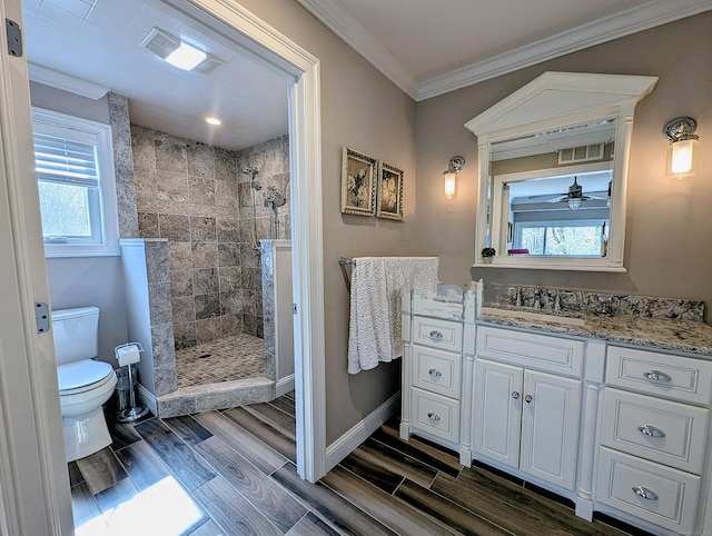 1036 Heritage Vlg Unit A, Southbury, CT 06488 - bathroom featuring toilet, wood finished floors, a tile shower, vanity, and ornamental molding