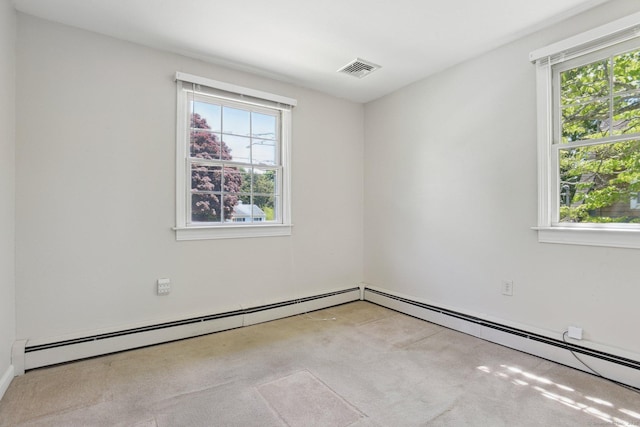 205 Ocean View Ave, Groton, CT 06355 - spare room with plenty of natural light, light colored carpet, and a baseboard heating unit