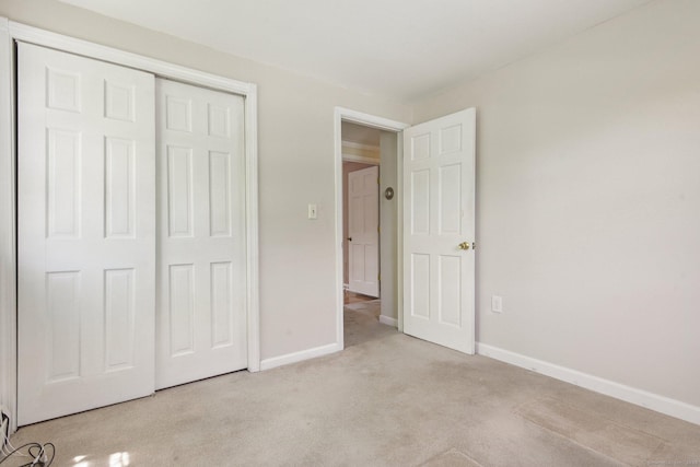 205 Ocean View Ave, Groton, CT 06355 - unfurnished bedroom featuring carpet flooring, baseboards, and a closet
