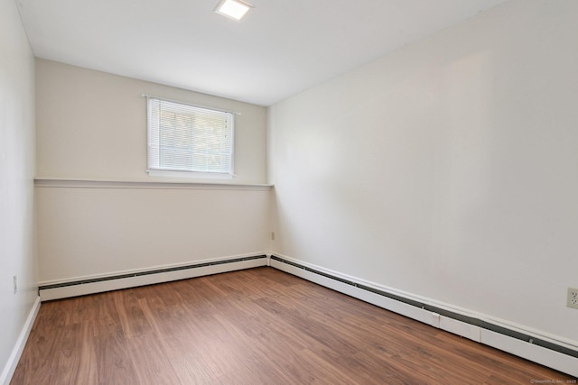 205 Ocean View Ave, Groton, CT 06355 - empty room featuring wood finished floors, baseboards, and a baseboard radiator