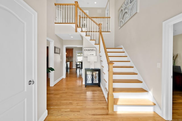 15 Lafountain Rd, Suffield, CT 06078 - stairs featuring wood finished floors, baseboards, and a high ceiling