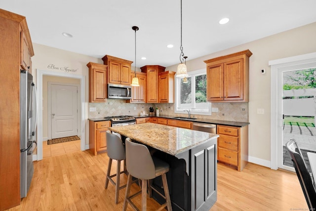 15 Lafountain Rd, Suffield, CT 06078 - kitchen with appliances with stainless steel finishes, a sink, light wood-type flooring, backsplash, and recessed lighting