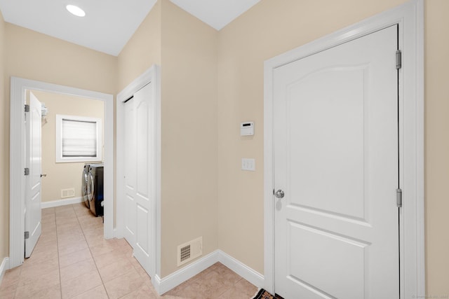 15 Lafountain Rd, Suffield, CT 06078 - hall featuring baseboards, light tile patterned floors, and washer / dryer