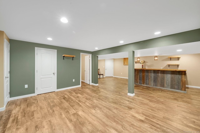 15 Lafountain Rd, Suffield, CT 06078 - unfurnished living room with wet bar, light wood finished floors, baseboards, and recessed lighting