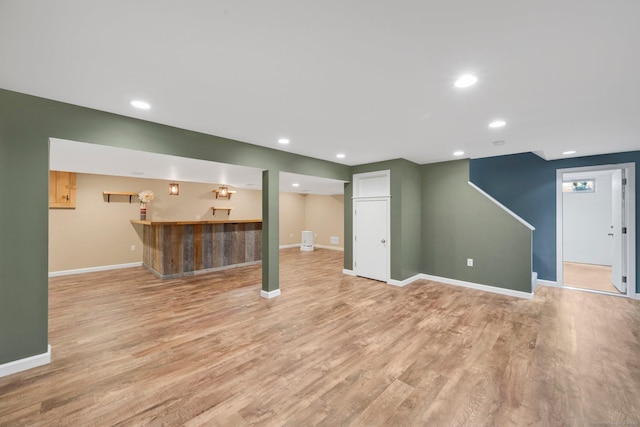 15 Lafountain Rd, Suffield, CT 06078 - finished basement with wet bar, baseboards, light wood-style flooring, and recessed lighting