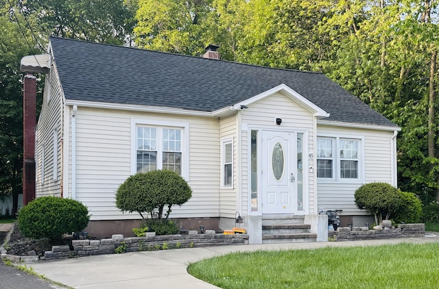 45 Valley Rd, Hamden, CT 06514 - view of front of property featuring entry steps, a chimney, and roof with shingles
