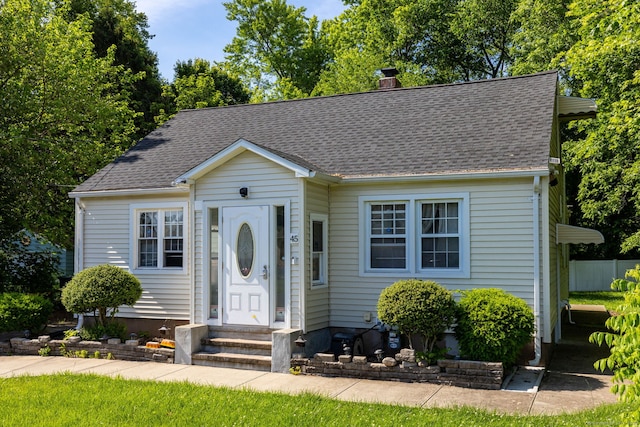 45 Valley Rd, Hamden, CT 06514 - view of front of property featuring entry steps, a chimney, and a shingled roof