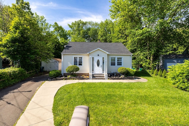 45 Valley Rd, Hamden, CT 06514 - bungalow-style home featuring a front yard and roof with shingles